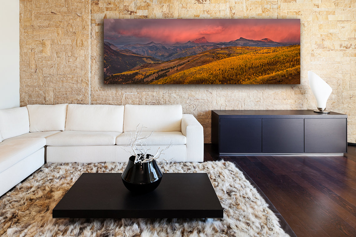 Panoramic fine art nature photography print hanging above a sofa in a modern home living room