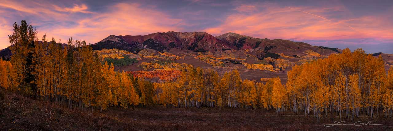 Rich fall color aspen trees meadow in front of mountains with a pink clouds sunset - Small