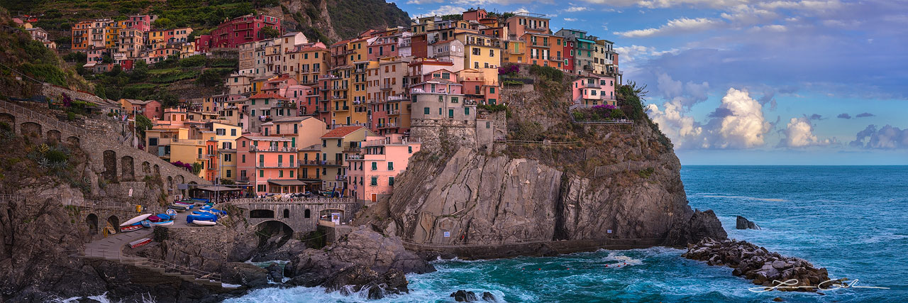 Colorful charming houses perched on a sea cliff overlooking the sea, Cinque Terre, Italy - Small
