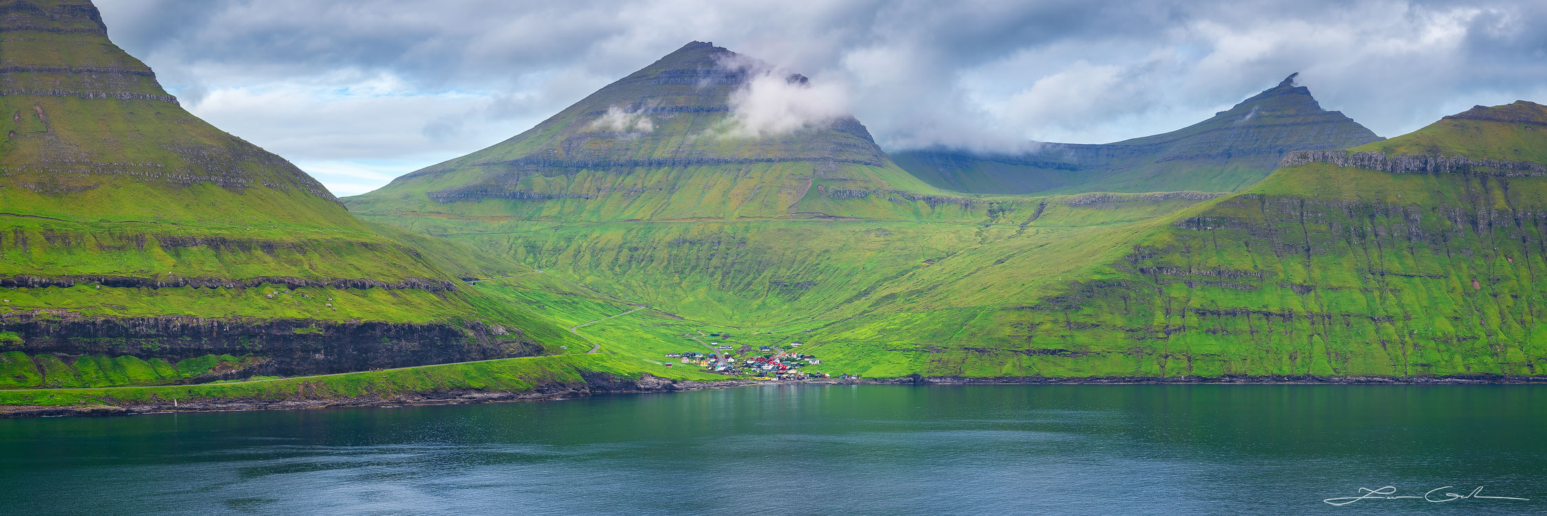 Beautiful tall lush mountains with steep shores leading into the ocean - Faroe Islands - Gintchin Fine Art