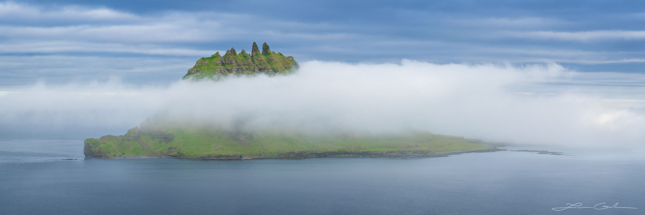 A beautiful mountain islan engulfed in ocean fog - Faroe Islands - Gintchin Fine Art