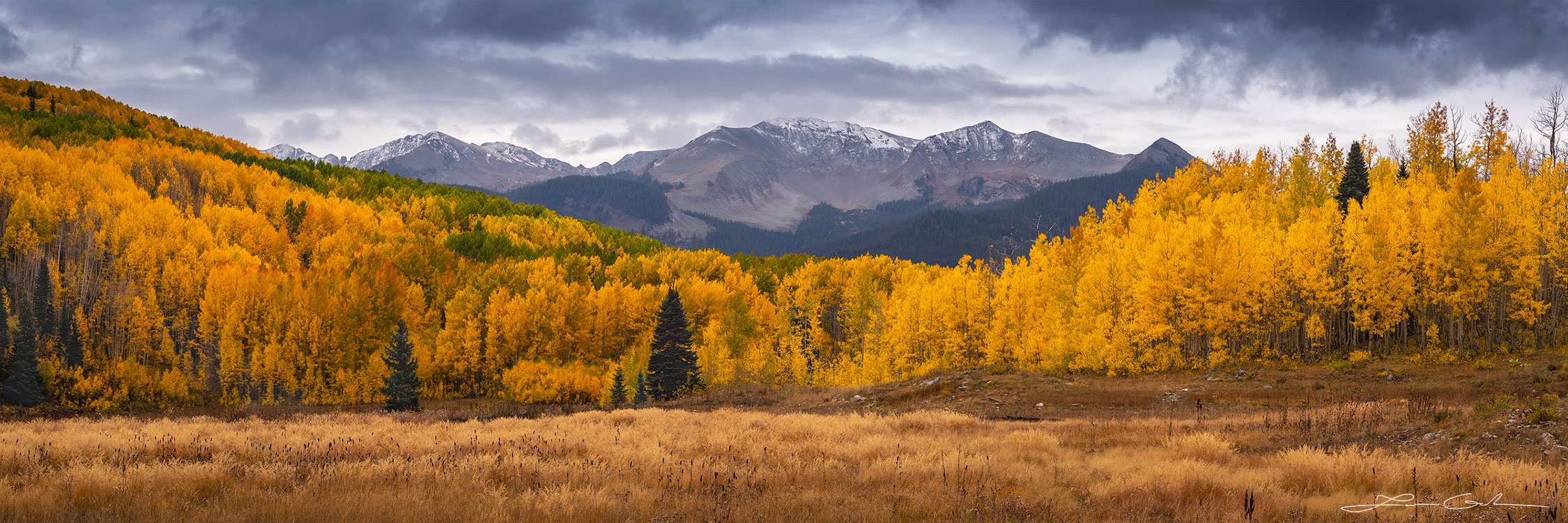 Fresh snow on mountain peaks and lots of autumn colors aspen trees - Gintchin Fine Art