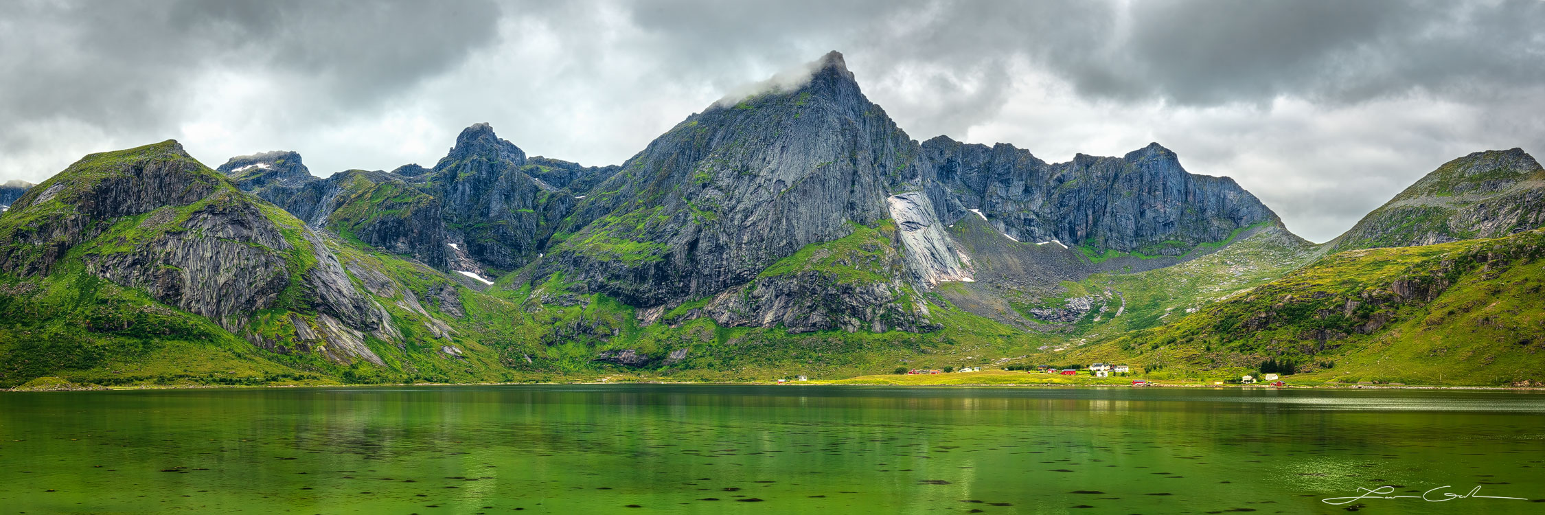 A jagged mountain rises above the sea water in the Lofoten Islands, Norway - Gintchin Fine Art