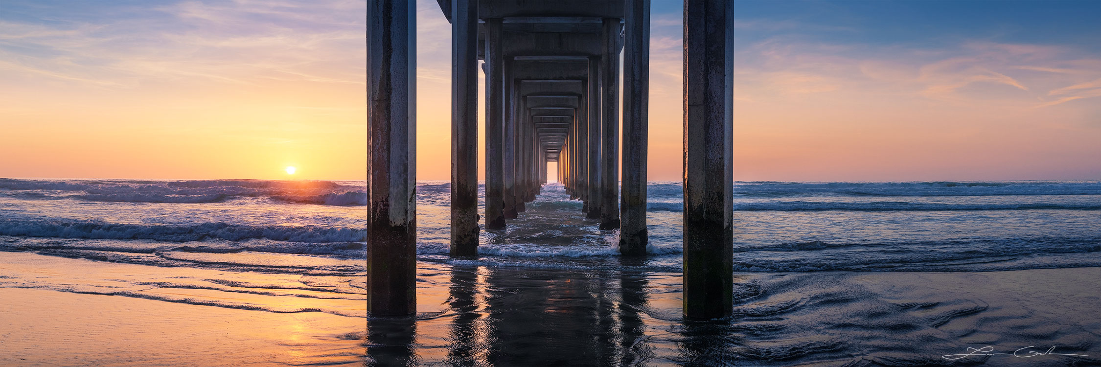 A California sunset warms the skies on a pleasant evening by the ocean beach - La Jolla’s Scripps Pier - Gintchin Fine Art