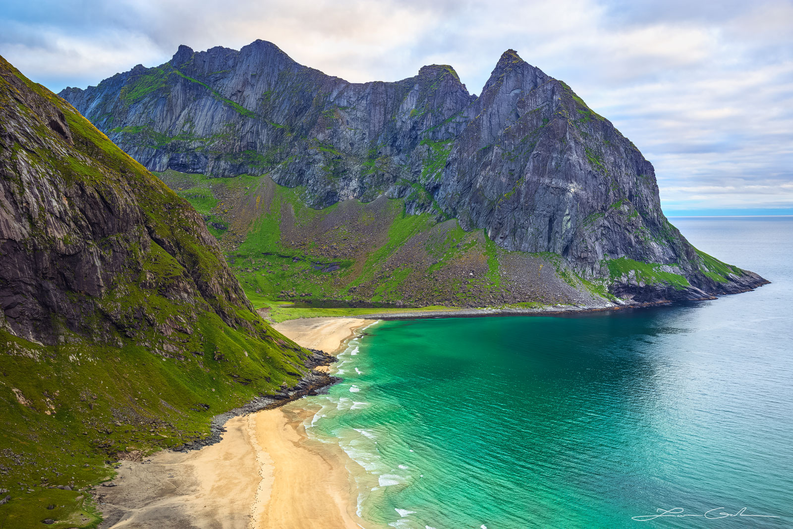 A turquoise beach with steep jagged mountains in the Lofoten Islands, Norway - Gintchin Fine Art