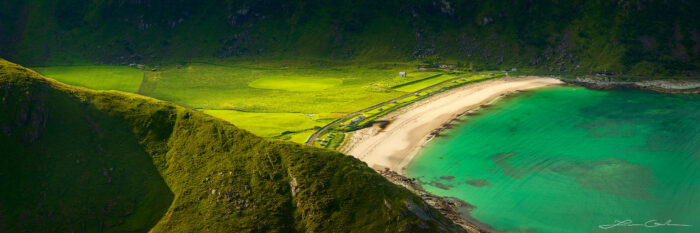 Dramatic light over a lush valley and a turquoise laguna in Lofoten, Norway - Gintchin Fine Art