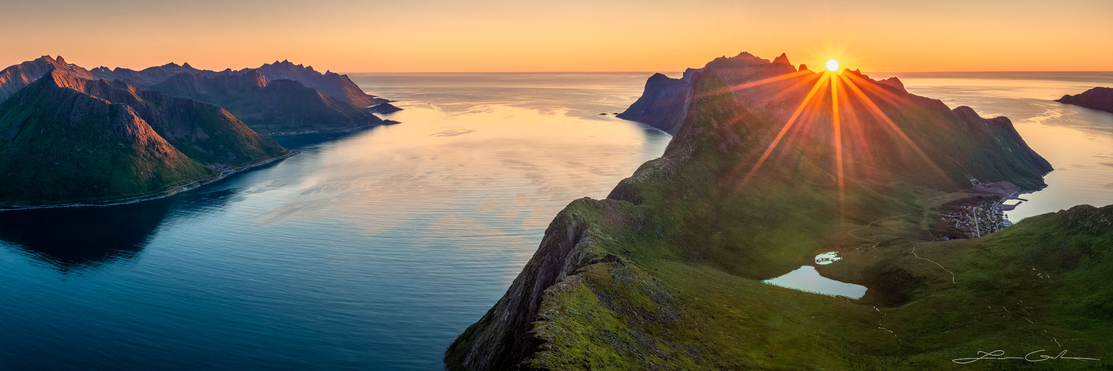 A sunset over mountains, ocean, and fjords in Senja, Norway - Gintchin Fine Art