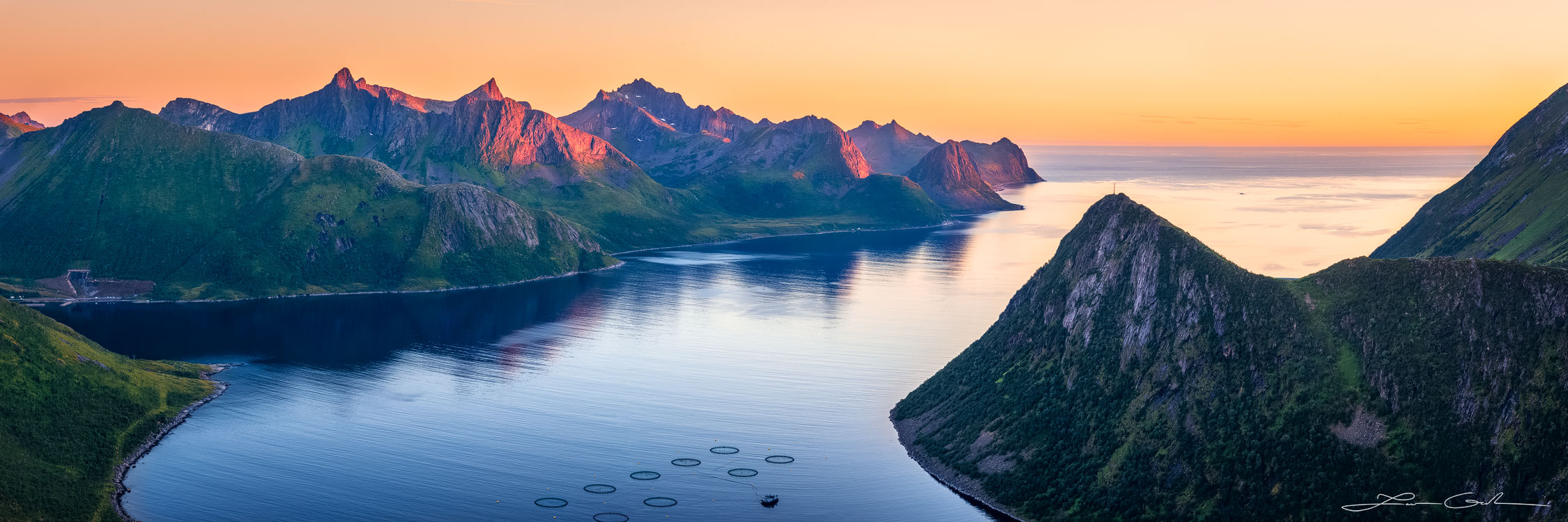 A beautiful sunrise with mountains surrounding a fjord in Senja, Norway - Gintchin Fine Art