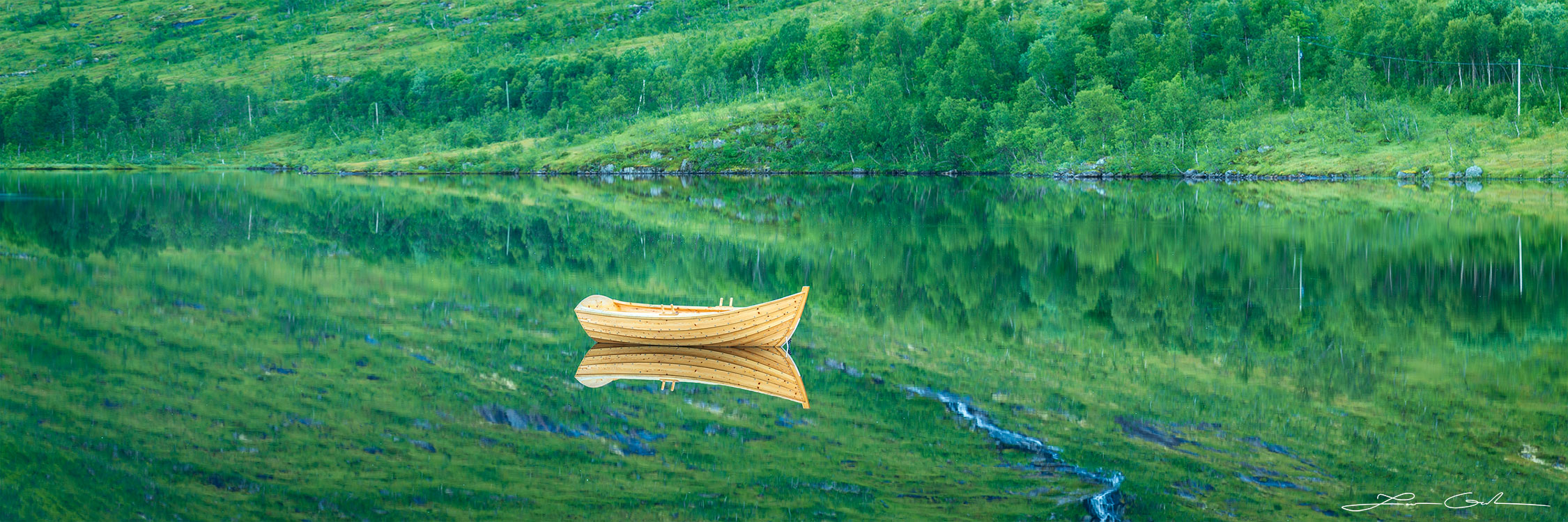A handcrafted beautiful boat reflection in a calm lake in Senja, Norway - Gintchin Fine Art
