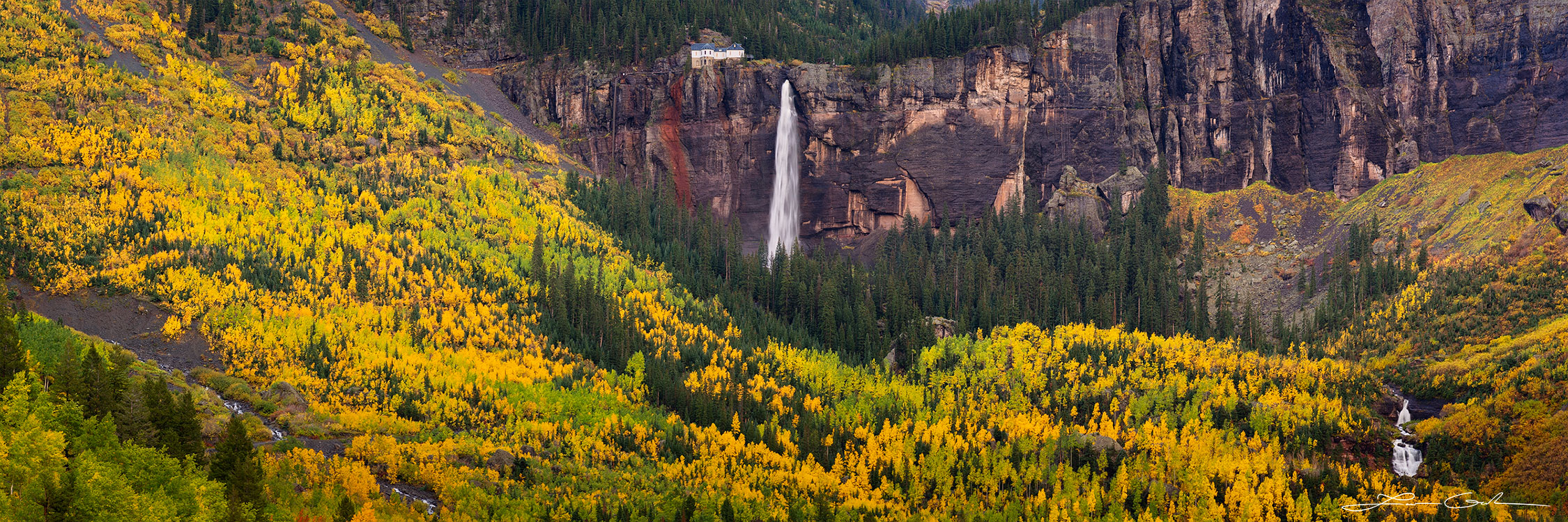 Panorama of bridal veul falls near Telluride, Colorado at peak fall colors with a big aspen valley and lots of aspen trees with golden leaves - Gintchin Fine Art