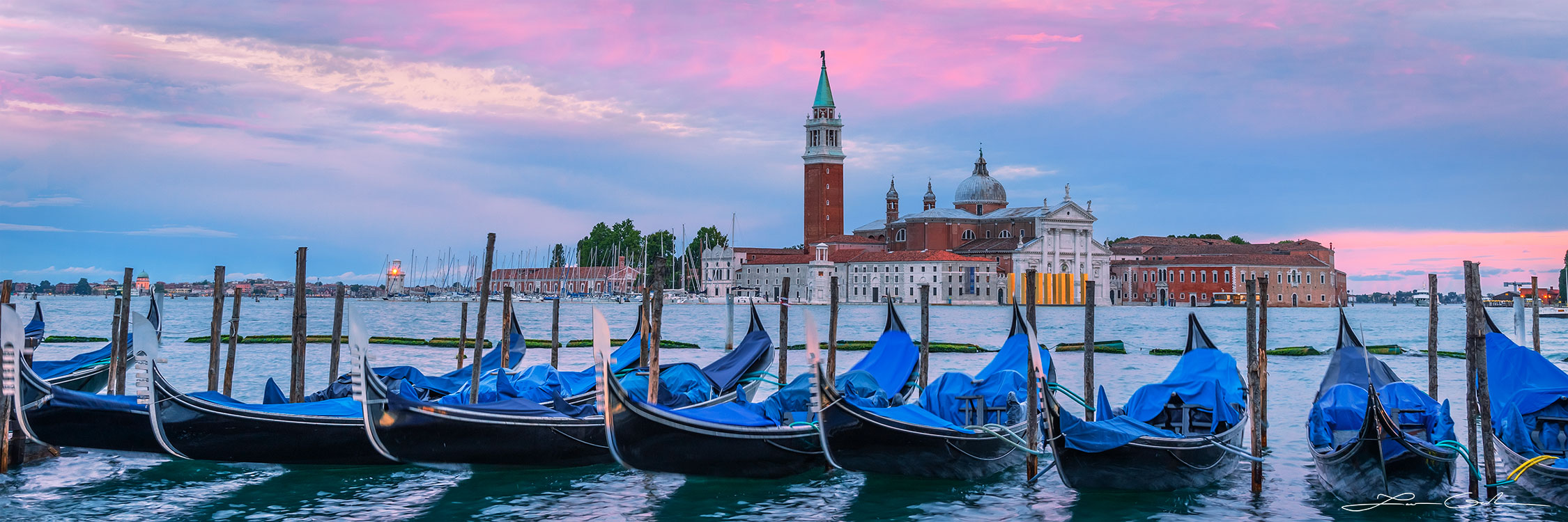 A row of gondola boats near San Marco square in Venice, Italy at sunset and the Church of San Giorgio Maggiore (Basilica di San Giorgio Maggiore) - Gintchin Fine Art