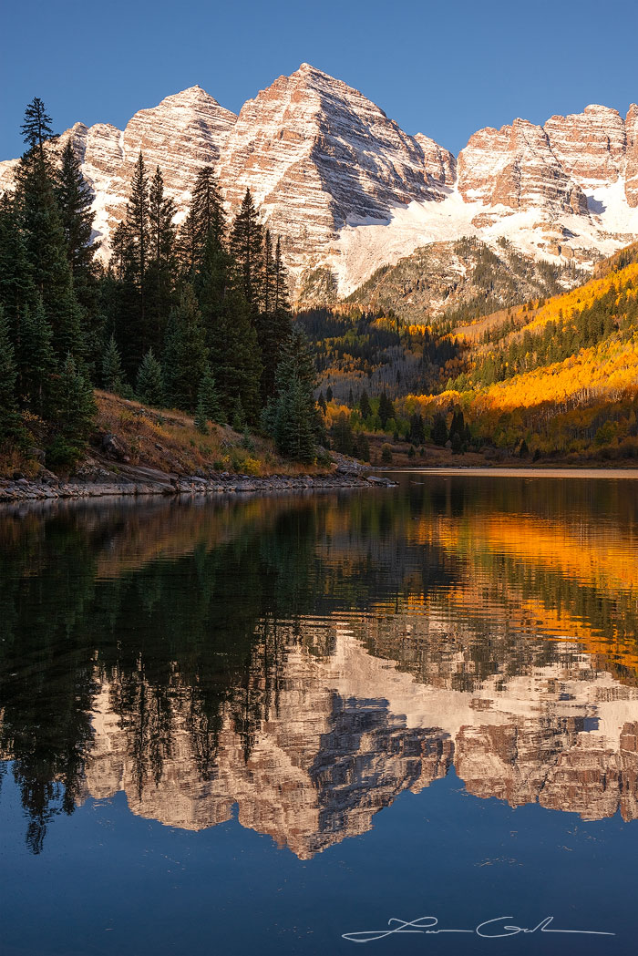 Maroon Bells mountains near Aspen, Colorado, reflected in the lake with peak fall colors - Gintchin Fine Art