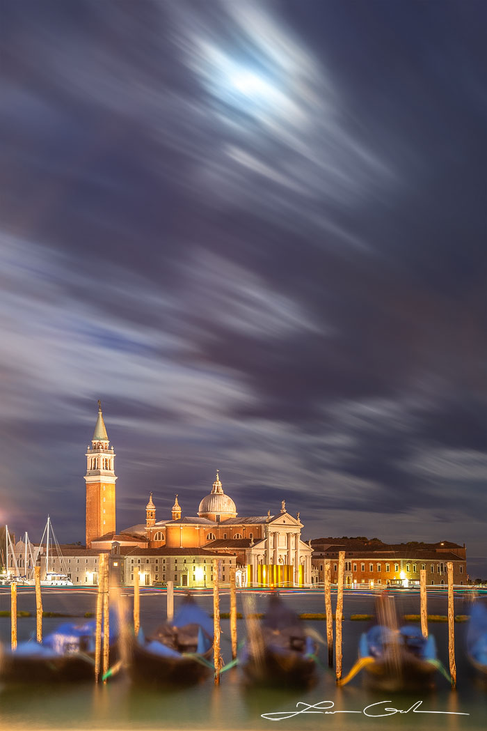A slow motion night shot in Venice, Italy with gondola boats and the Church of San Giorgio Maggiore (Basilica di San Giorgio Maggiore) - Gintchin Fine Art