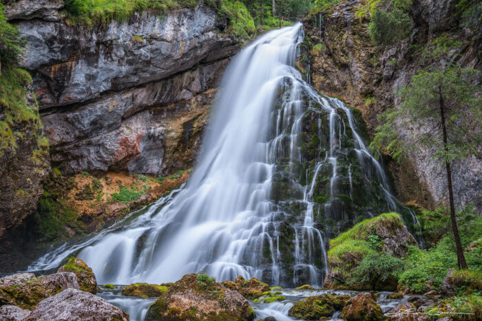 A beautiful waterfall with smooth and silky water from slow motion in Austria - Gintchin Fine Art