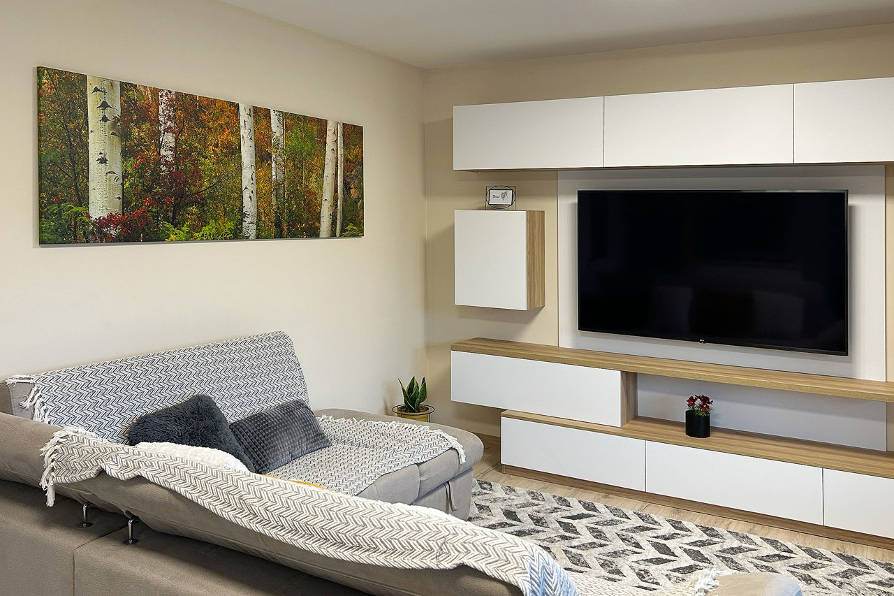 A panoramic wall art print on a wall in a modern living room - Gintchin Fine Art