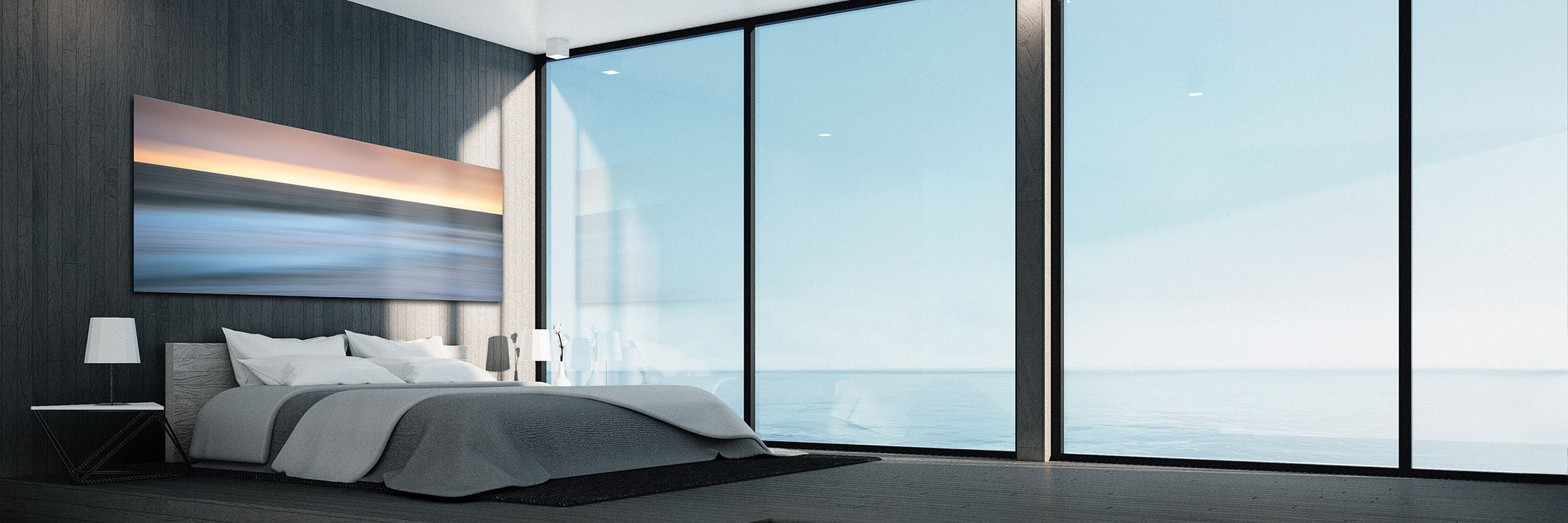 Luxury wall art panoramic print of an abstract ocean hanging above the bed in a master bedroom with a glass wall of an ocean view - Gintchin Fine Art