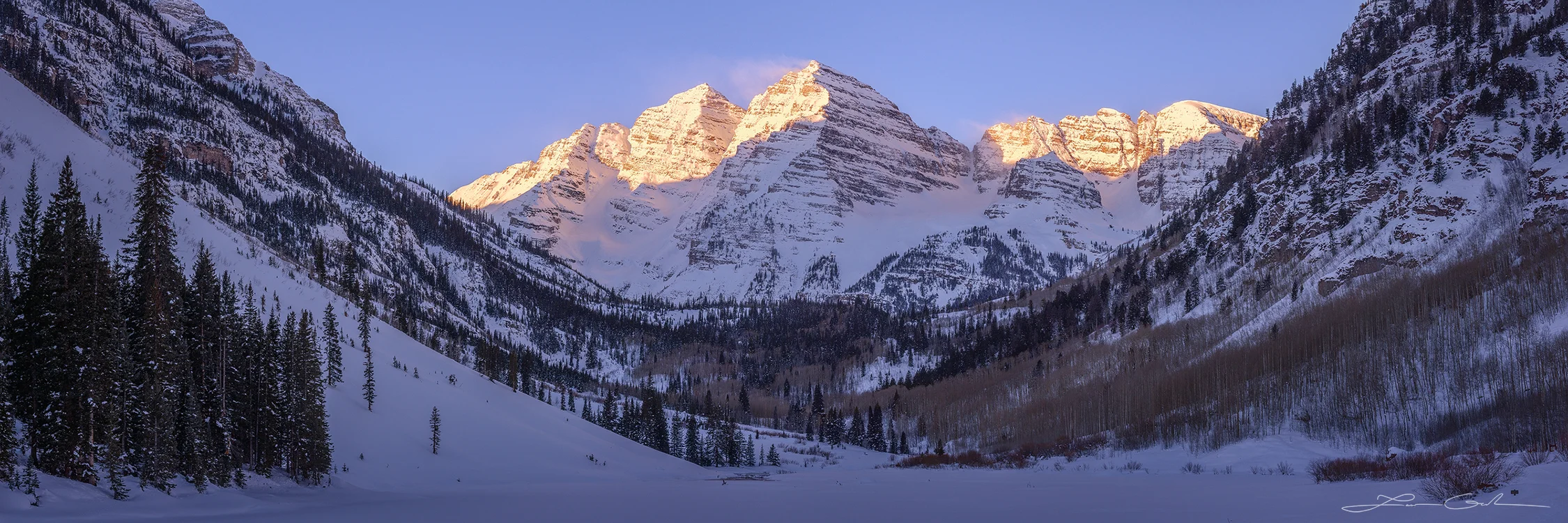 Maroon Bells Wonderland fine art photo print showcasing the beautiful Maroon Bells in January with snow-covered slopes, pine and aspen trees, and morning light. - Gintchin Fine Art
