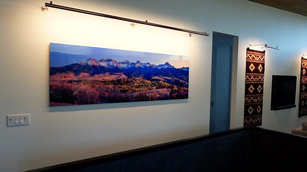 A huge metal print of the Sneffels Range hanging on a gallery wall in a contemporary home - Gintchin Fine Art